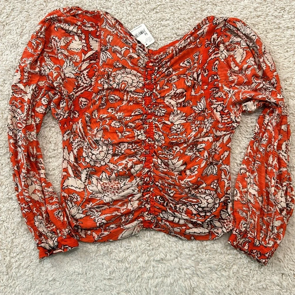 NWT FREE PEOPLE M Say the Word top with balloon sleeves in funky V neck style